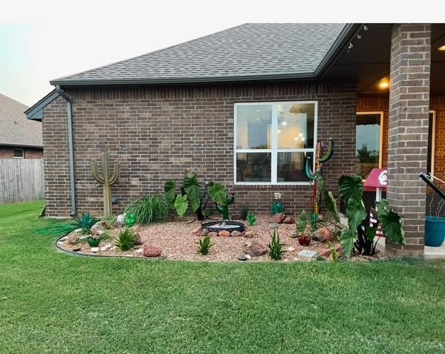 view of side of home featuring a yard