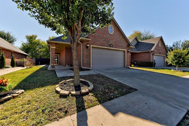 view of front of home with a garage and a front yard