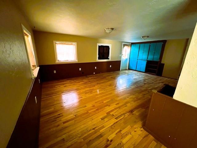 unfurnished living room featuring wood-type flooring