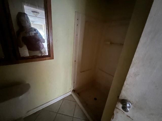 bathroom featuring a shower and tile patterned floors