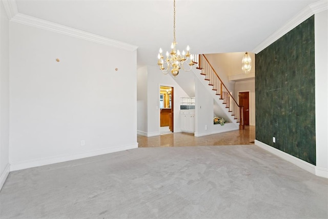 carpeted empty room featuring ornamental molding and a notable chandelier