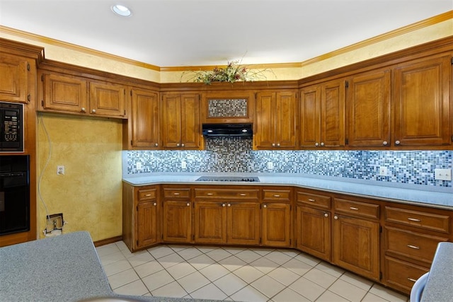 kitchen with light tile patterned floors, decorative backsplash, and black appliances