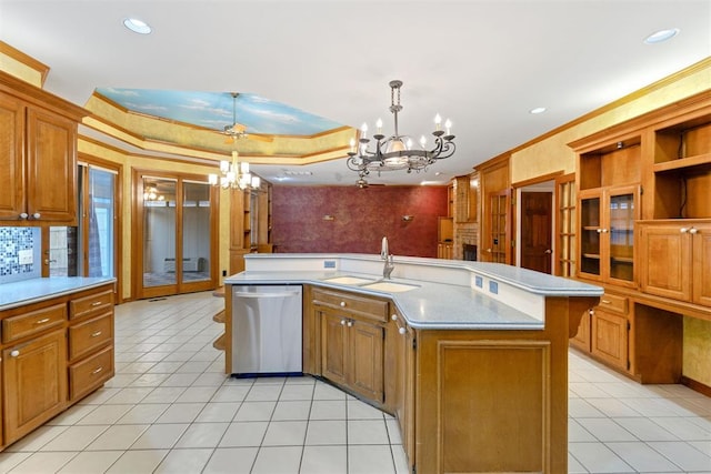 kitchen featuring pendant lighting, an island with sink, stainless steel dishwasher, a notable chandelier, and crown molding