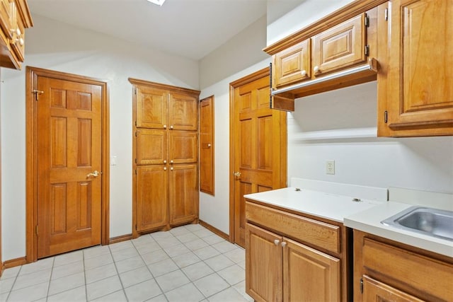 kitchen with light tile patterned floors