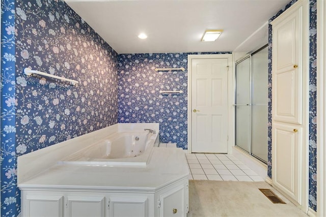 bathroom with tile patterned floors and a shower with shower door