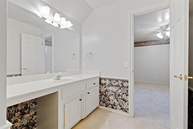 bathroom with vanity, vaulted ceiling, and ceiling fan