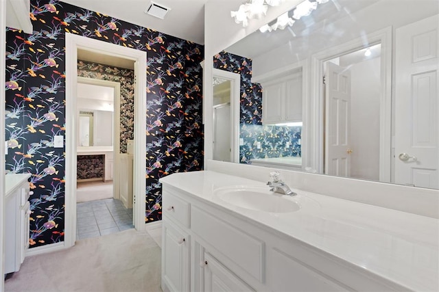 bathroom featuring tile patterned flooring and vanity