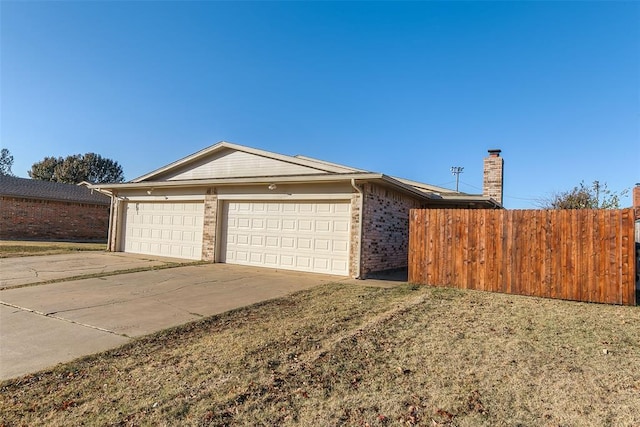 view of side of property featuring a garage