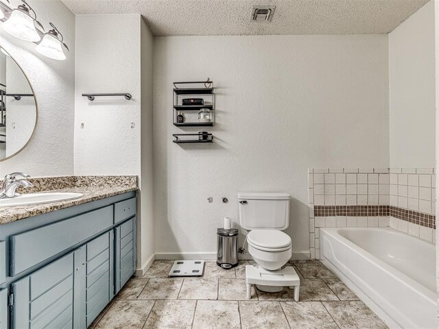 bathroom featuring visible vents, toilet, a textured ceiling, baseboards, and a bath