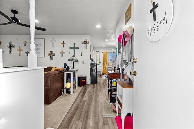 hallway with hardwood / wood-style flooring