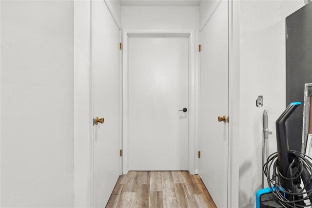 hall with light hardwood / wood-style floors