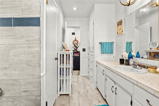 bathroom with backsplash and vanity