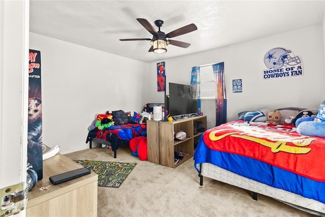 bedroom featuring ceiling fan and carpet