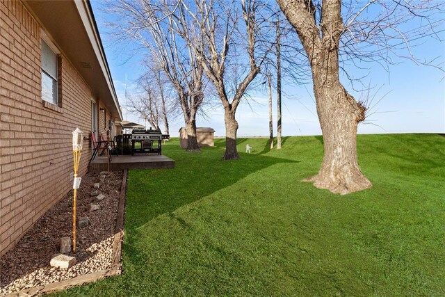 view of yard with a wooden deck