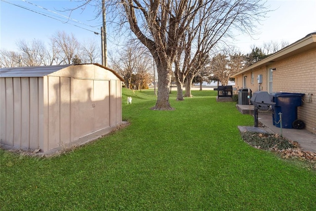 view of yard with a shed and central air condition unit