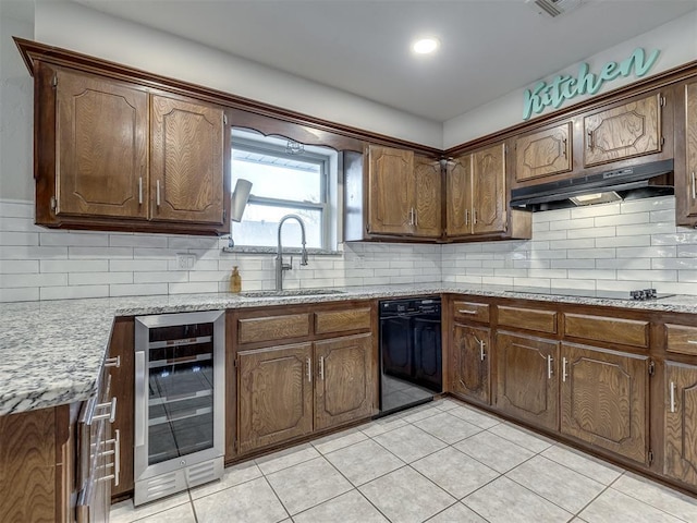 kitchen with sink, wine cooler, tasteful backsplash, and black appliances