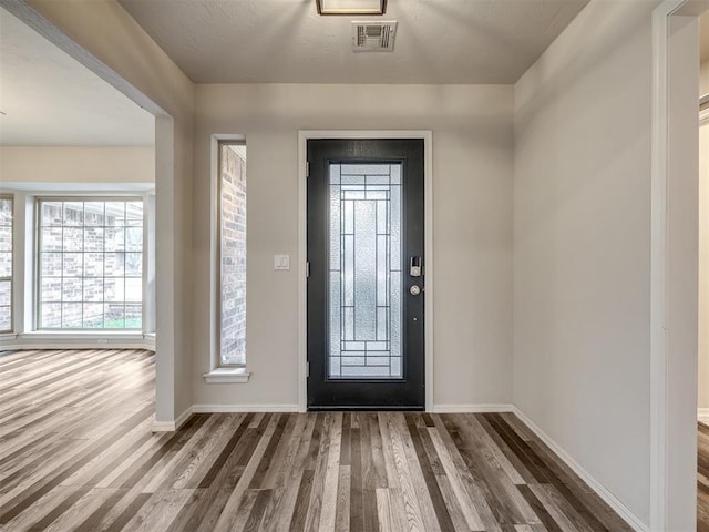 foyer entrance with hardwood / wood-style flooring