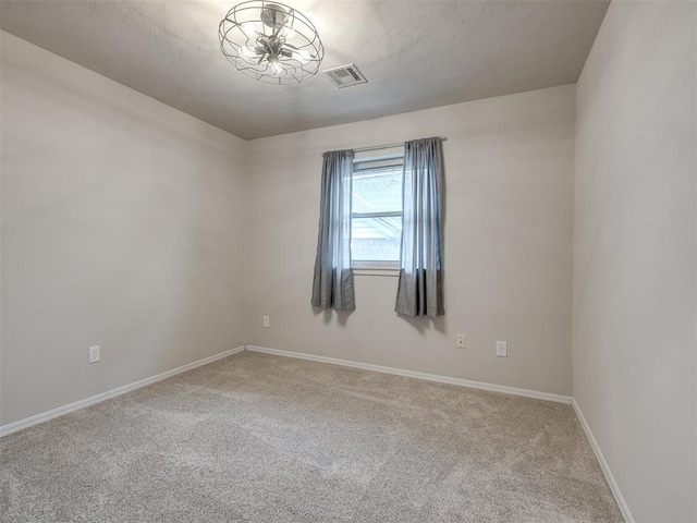 unfurnished room featuring carpet floors