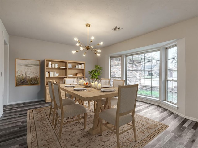 dining room featuring dark wood-type flooring and a chandelier