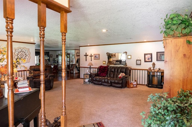 living room with a textured ceiling, crown molding, and carpet flooring