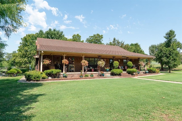 ranch-style home featuring a front lawn