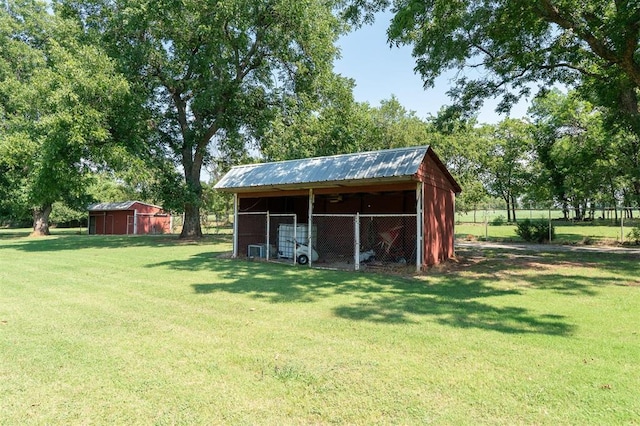 view of outdoor structure with a lawn