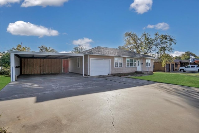 view of front of property featuring a front lawn and a garage