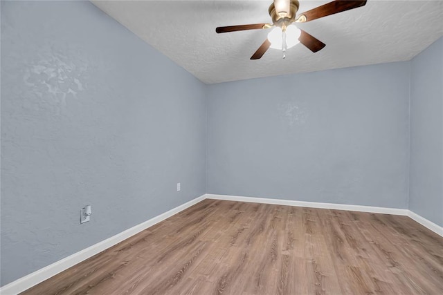 spare room featuring ceiling fan, a textured ceiling, and light hardwood / wood-style flooring