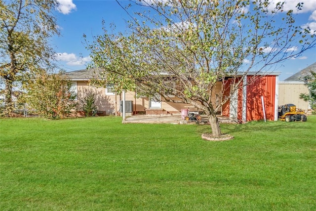 view of yard with an outdoor structure and a patio