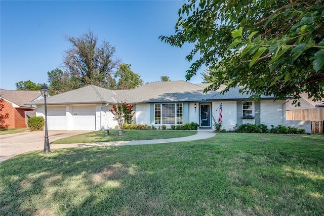 single story home with a garage and a front lawn