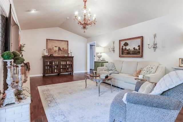 living room featuring dark hardwood / wood-style flooring, lofted ceiling, and a chandelier