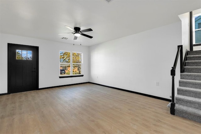 foyer entrance featuring light hardwood / wood-style floors and ceiling fan