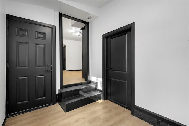 interior space with light hardwood / wood-style flooring