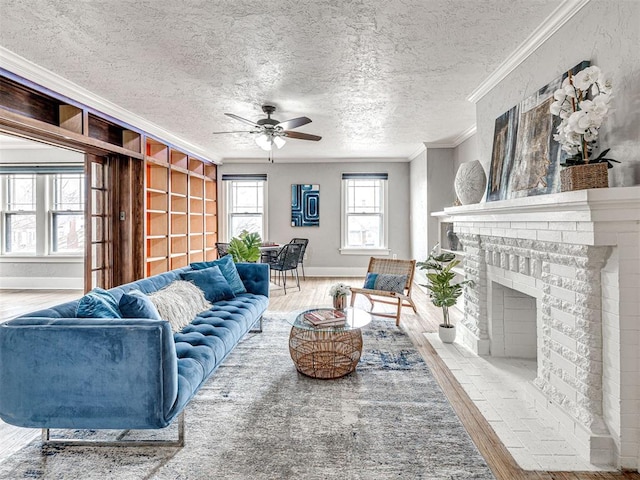 living room featuring crown molding, wood-type flooring, a textured ceiling, and a fireplace