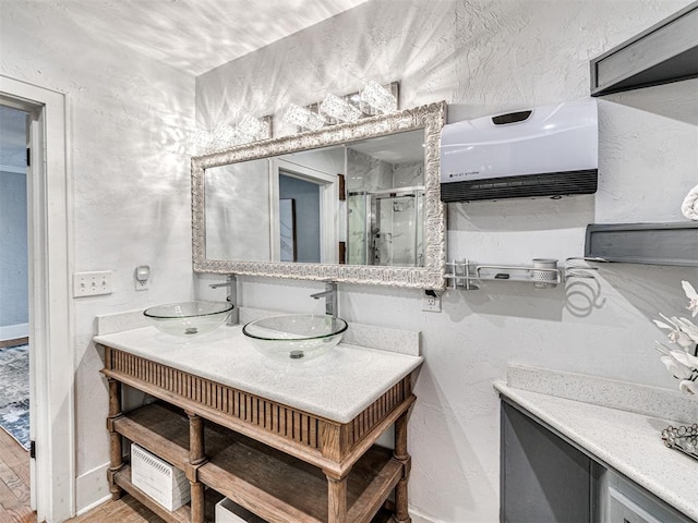 bathroom featuring vanity, hardwood / wood-style floors, and an enclosed shower