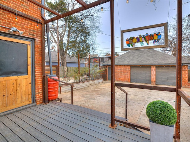 wooden terrace with a garage