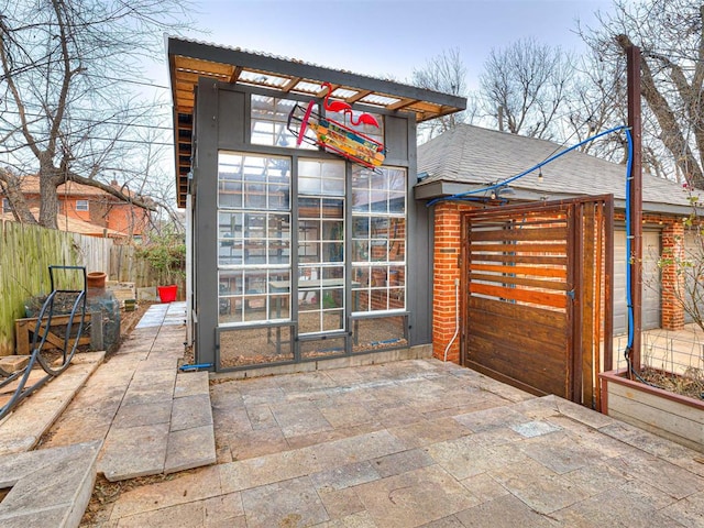 view of front of house with an outbuilding