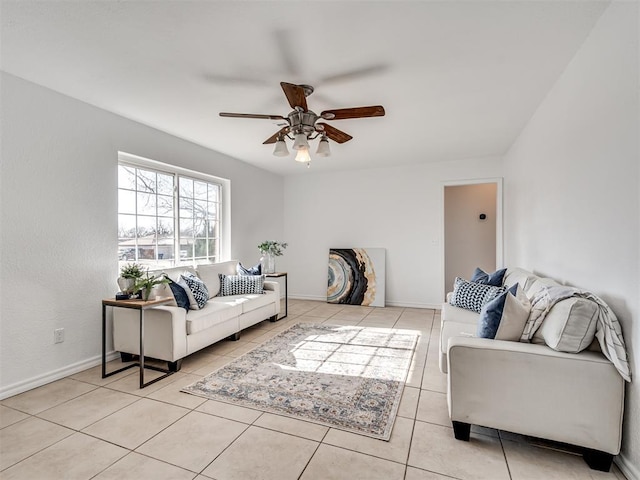 tiled living room featuring ceiling fan