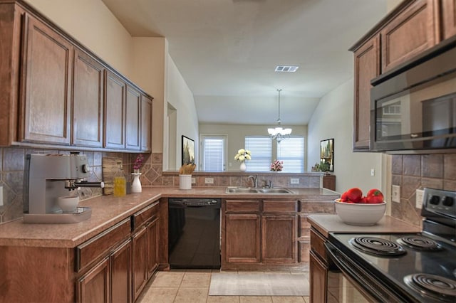 kitchen featuring sink, an inviting chandelier, hanging light fixtures, black appliances, and light tile patterned flooring