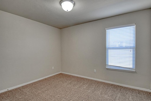 unfurnished room with light carpet