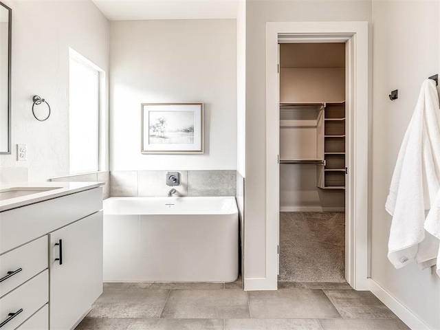 bathroom featuring vanity and a bathing tub