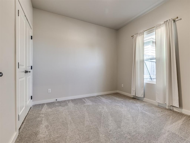 unfurnished room featuring carpet flooring