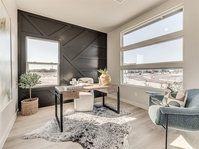 office space featuring a healthy amount of sunlight and light wood-type flooring