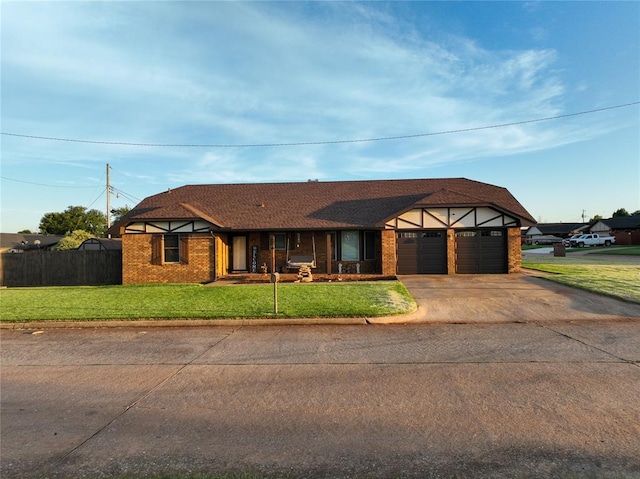 view of front of house featuring a front yard and a garage