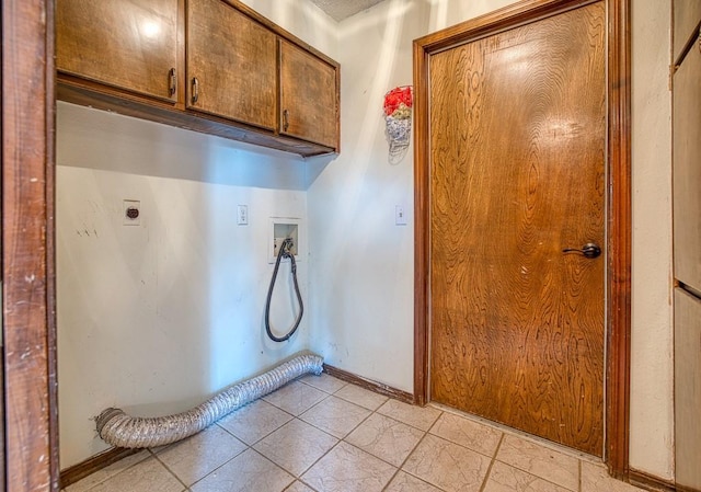 washroom with washer hookup, cabinets, and hookup for an electric dryer