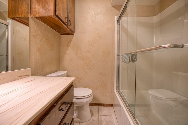 full bathroom with toilet, vanity, tile patterned flooring, and shower / bath combination with glass door