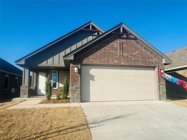 view of front of house featuring brick siding, board and batten siding, concrete driveway, and an attached garage