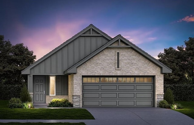 view of front of property with concrete driveway, a garage, board and batten siding, and stone siding