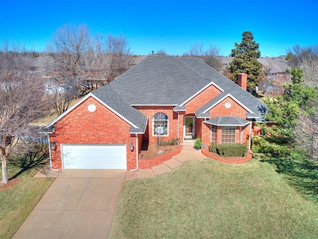 view of front of house featuring an attached garage, brick siding, concrete driveway, a front lawn, and a chimney