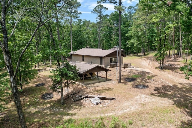 rear view of house with a carport